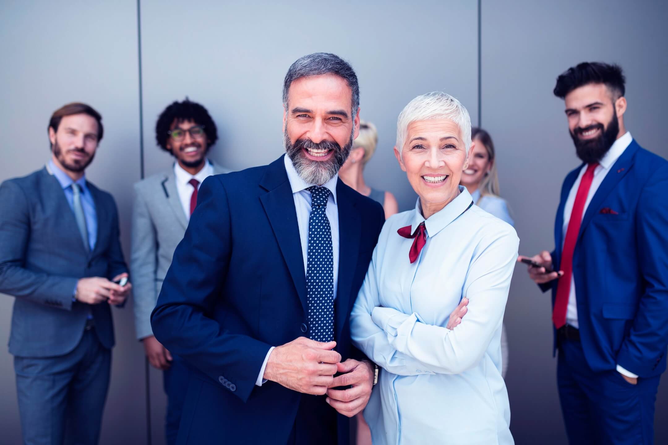portrait-of-businesspeople-standing-with-arms-7LWEQFP-scaled.jpg